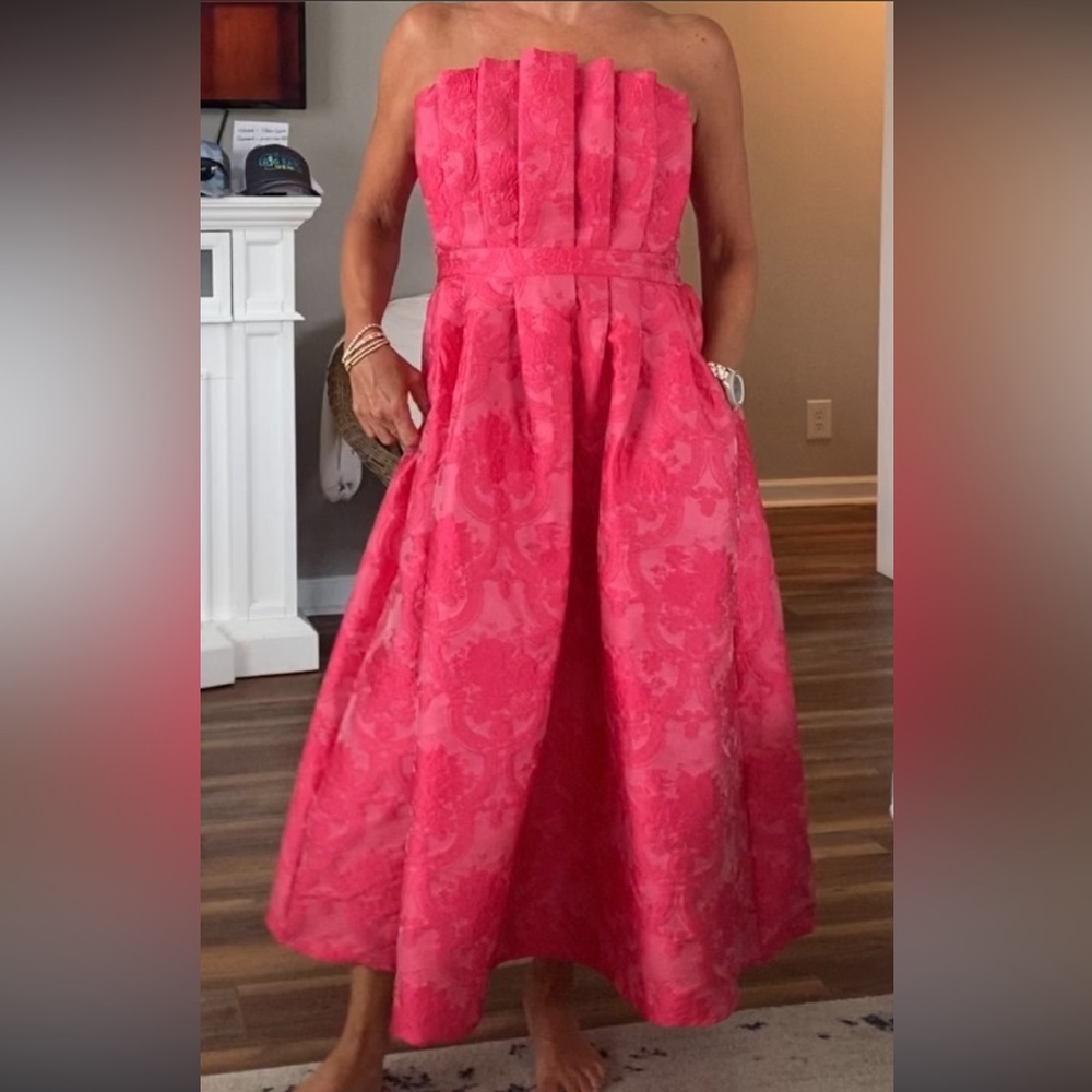 Beautiful pink strapless dress. Size M and new with tags.